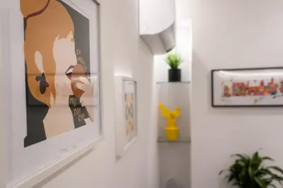 a living room with two framed pictures on the walls at Casa Chicotta- Libertà in Palermo