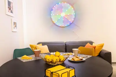 a dining room table with a plate of fruit on it at Casa Chicotta- Libertà in Palermo