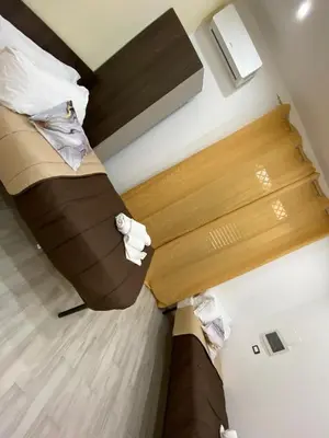 an overhead view of a bed in a hotel room at I Conti della Zisa in Palermo