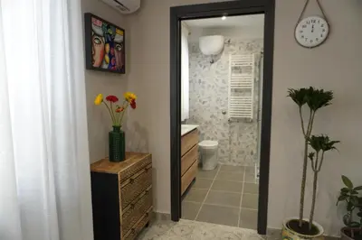 a bathroom with a sink and a mirror at Maria's Home in Altavilla Milicia
