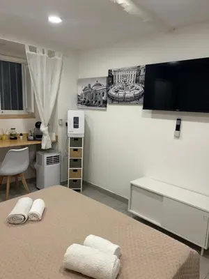 a bedroom with a bed with two towels on it at All'Oro Suite & go in Palermo