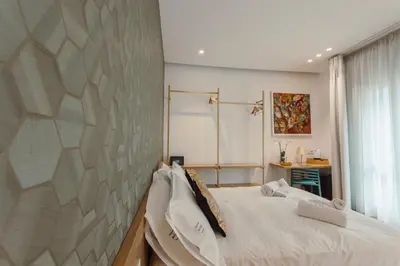 a bedroom with a large bed and a window at HrD Luxury Rooms in Palermo