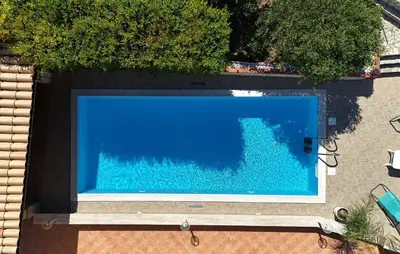 an overhead view of a large blue swimming pool at Stunning Home In Trabia in Trabia