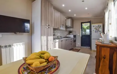 a bowl of fruit on a table in a kitchen at Stunning Home In Trabia in Trabia