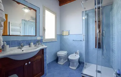 a bathroom with a sink and a toilet and a shower at Stunning Home In Trabia in Trabia