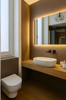 a bathroom with a sink and a toilet and a mirror at GoriziaHome in Palermo