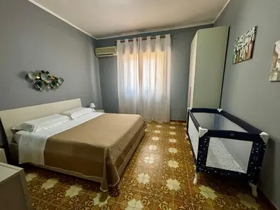 a bedroom with a bed and a window in it at Al49house in Palermo