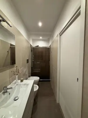a bathroom with a white sink and a toilet at Sguardo a Ponente in Castellammare del Golfo
