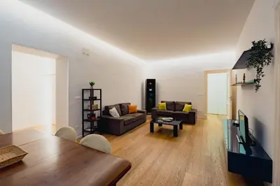 a living room with a couch and a table at Santa Sofia con Terrazza by Wonderful Italy in Palermo