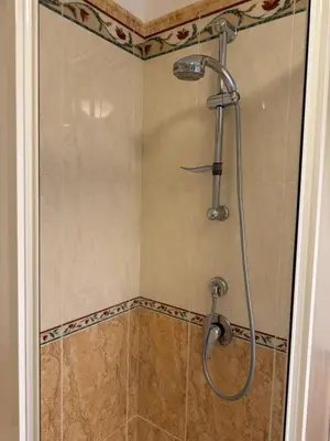 a shower with a glass door in a bathroom at Carol's Sicily Dream in San Vito lo Capo