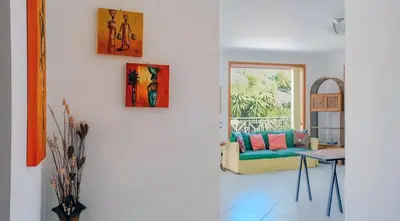 a living room with a couch and a table at Villa Viola e Giulio in Scopello