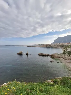 a large body of water with rocks in it at Casa Kialy in Terrasini