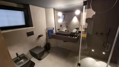 a bathroom with a sink and a toilet and a shower at Suitt Drims 6 in Palermo