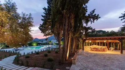 a house with a swimming pool and a pavilion at Casale Buccellato 14 by Massimo Villas in Castellammare del Golfo