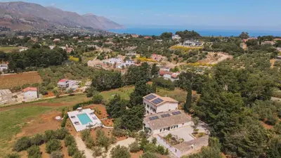 an aerial view of a house on a hill at Casale Buccellato 14 by Massimo Villas in Castellammare del Golfo