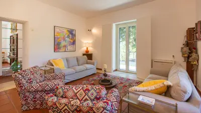 a living room with two couches and a couch at Casale Buccellato 14 by Massimo Villas in Castellammare del Golfo