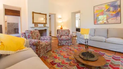 a living room with a couch and chairs and a table at Casale Buccellato 14 by Massimo Villas in Castellammare del Golfo
