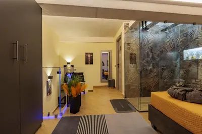 a bedroom with a large glass shower in a room at A' Casuzza Suite Room in Porticello