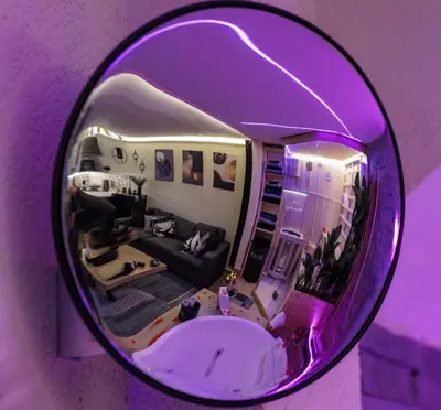 a mirror reflecting a living room with a couch at A' Casuzza Suite Room in Porticello