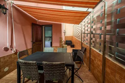 a dining room with a table and chairs at Casa Vacanze Cappuccini in Castellammare del Golfo
