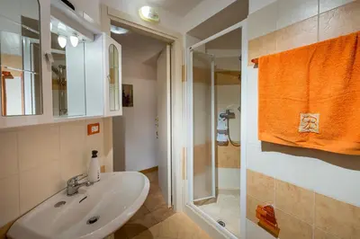 a bathroom with a sink and a shower at Casa Vacanze Cappuccini in Castellammare del Golfo