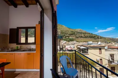a balcony with a view of a city at Casa Vacanze Cappuccini in Castellammare del Golfo