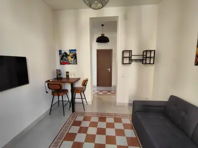 a living room with a couch and a table at Palazzo Orangea 1 piano in Bagheria