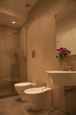 a bathroom with a sink and a toilet and a shower at Rosalmar B&B in Palermo