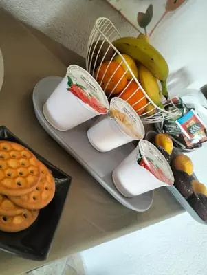 a plate of food with cheese and fruit and waffles at Granello di Sabbia in San Vito lo Capo