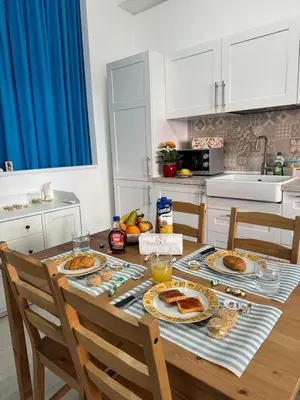 a kitchen with a table with plates of food on it at mamali in Terrasini