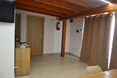a room with a door and a room with a table at Casa Asprigna in Ficarazzi