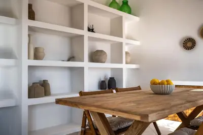 a kitchen with a white refrigerator and blue tiles at Torre delle mandre in Altavilla Milicia