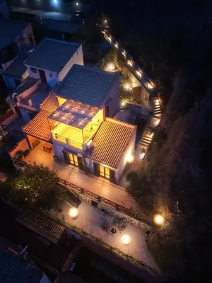 an overhead view of a house at night with lights at Torre delle mandre in Altavilla Milicia