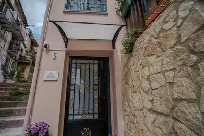 a door in a building with a stone wall at La Casetta di Dandrì in Monreale