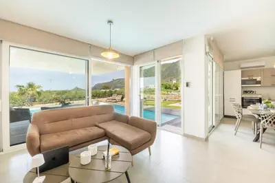 a living room with a couch and a table at Villa Soho in Castellammare del Golfo