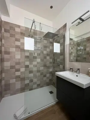 a bathroom with a sink and a shower at MGrooms in Palermo