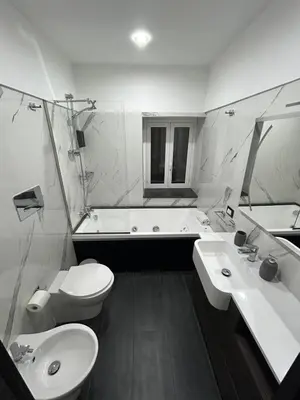 a bathroom with a toilet and a sink and a tub at Maisondedesign in Palermo