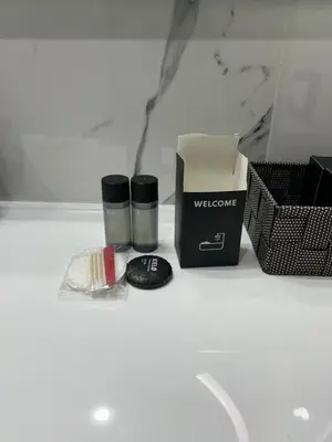 a bathroom with a box of welcome products on a counter at Maisondedesign in Palermo