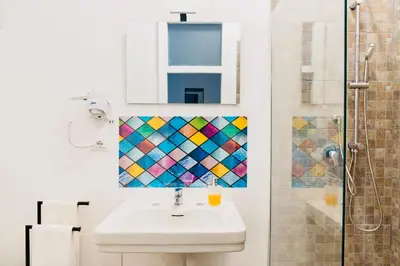 a bathroom with a sink and a shower at Piano Imperiale Home in Palermo
