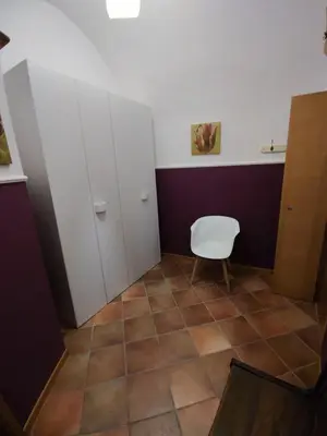 a bathroom with white cabinets and a toilet at Casa Frufa in Terrasini