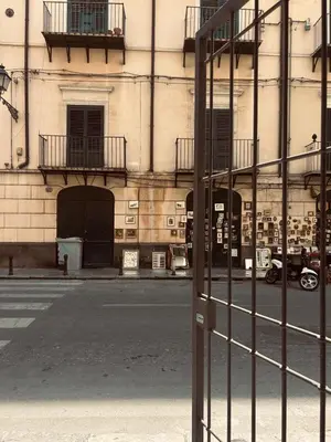 a metal fence in front of a building at Manuè's House in Palermo