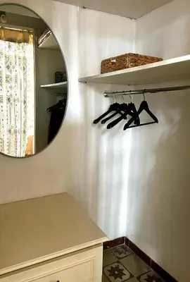 a bathroom with a mirror and a shelf withweapons at Casa Mediterraneo in Palermo