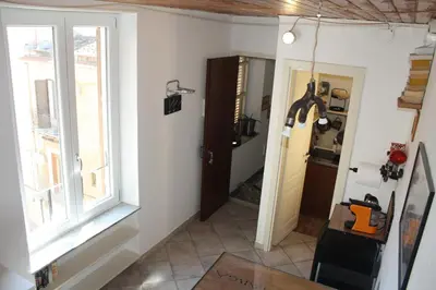 a hallway with a window and a door at Targa Moto Art in Palermo