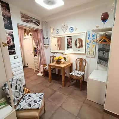 a small dining room with a table and chairs at Casa Emilia in Palermo