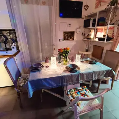 a dining room table with a blue table cloth on it at Casa Emilia in Palermo
