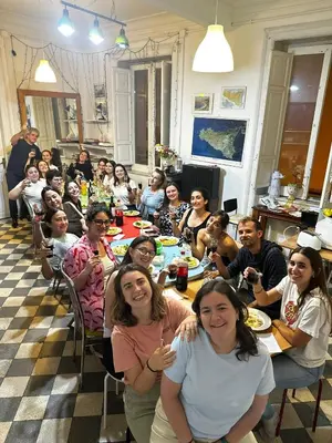 a group of people sitting at a table at Via Zara Arararooms in Palermo