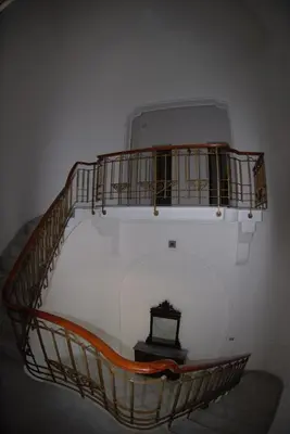 a spiral staircase with a clock on top of it at Villa 7 Palms Mondello Palermo Sicily in Palermo