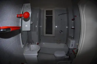 a bathroom with a tub and a toilet and a sink at Villa 7 Palms Mondello Palermo Sicily in Palermo