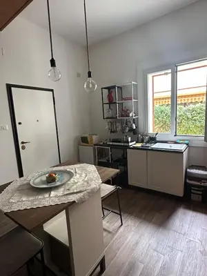 a kitchen with a table with a plate on it at Casa Vacanza Mondello nel Cuore in Mondello