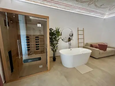 a bathroom with a bath tub and a shower at Massimo Rooms and suite in Palermo